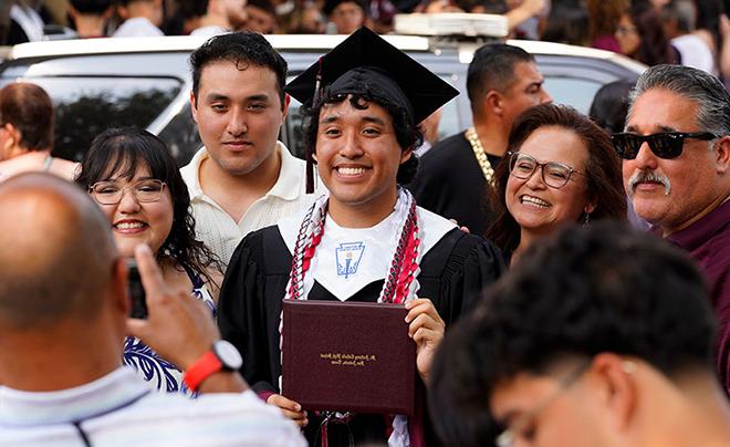 student with family at graduation